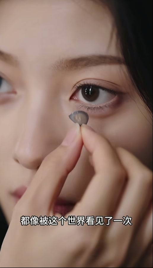 Screenshot of the photoreal AI drama Bei Cai Dai De Nv Hai, a close-up of a character inserting a contact lens